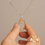 Osmanthus necklace with floral pendant design