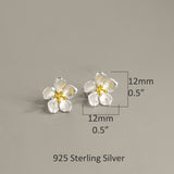 Peach blossom flower earrings displayed as a pair