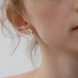 Peach blossom flower studs close-up