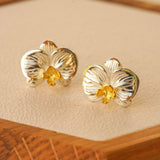 Phalaenopsis orchid earrings displayed as a pair