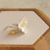 Poppy floral jewelry ring with botanical design