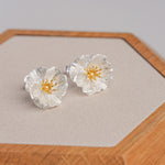 Poppy flower stud earrings close-up