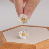 Poppy flower stud earrings displayed as a pair