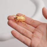 Handmade gold rhinoceros beetle brooch