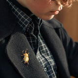 Rhinoceros beetle brooch with sculpted shell details