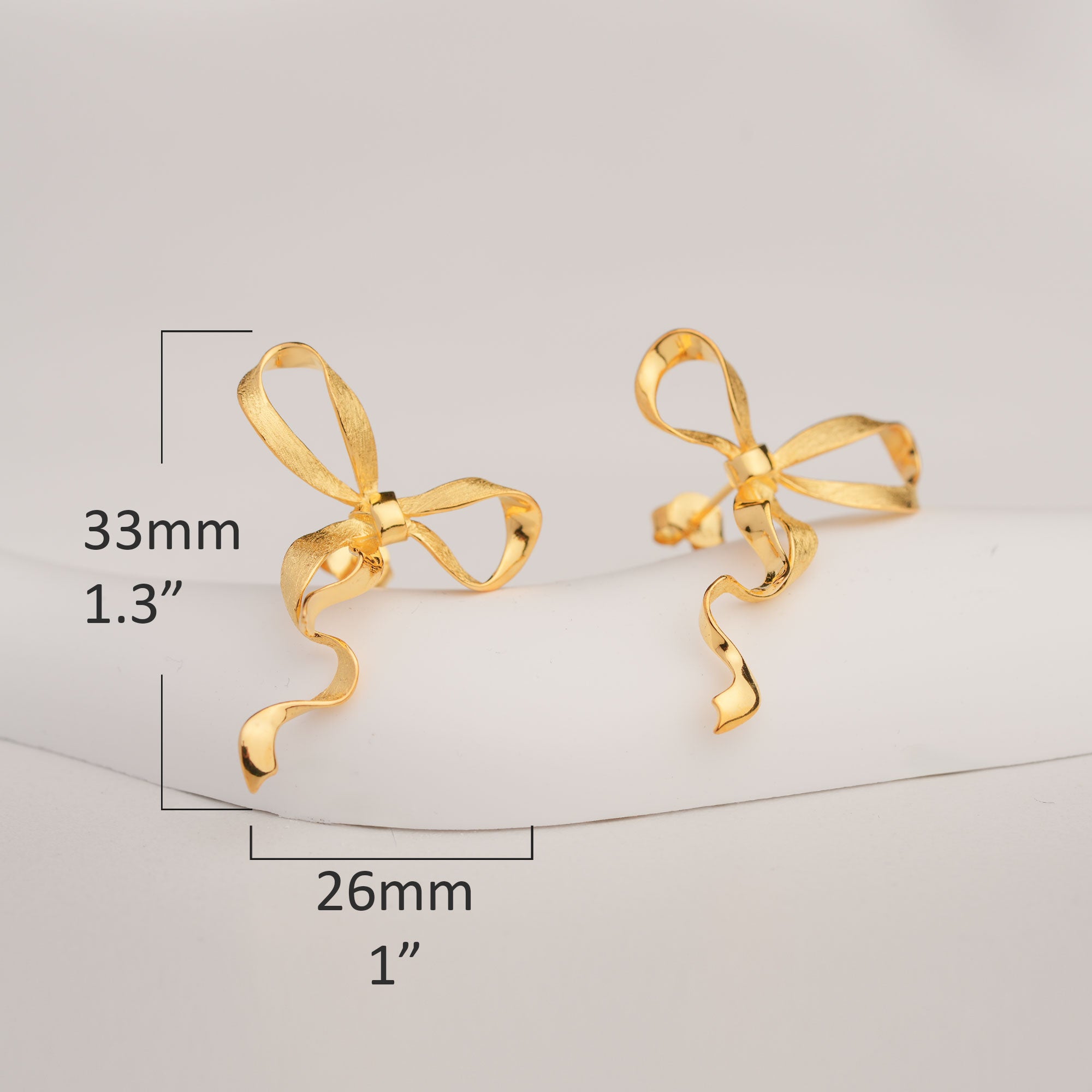 Ribbon knot earrings product detail view