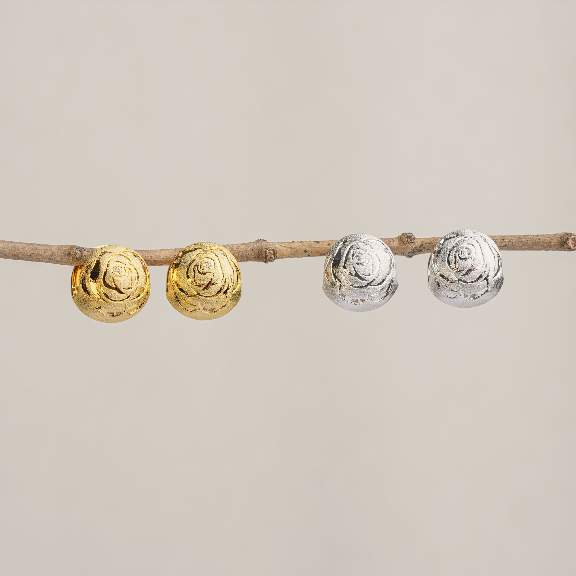 Rose dome earrings displayed as a pair