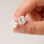 Rosebud stud earrings displayed as a pair