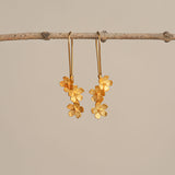 Silver cherry blossom flower earrings close-up