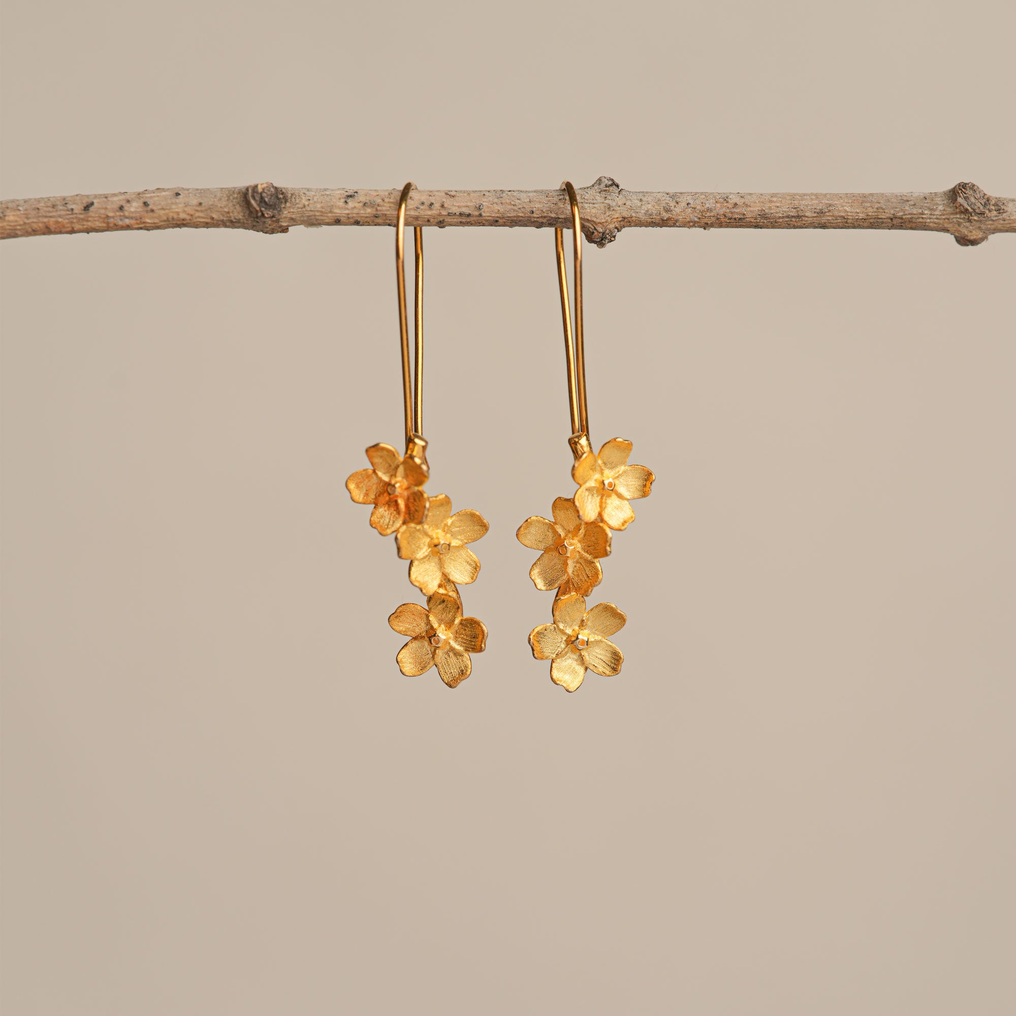 Silver cherry blossom flower earrings close-up