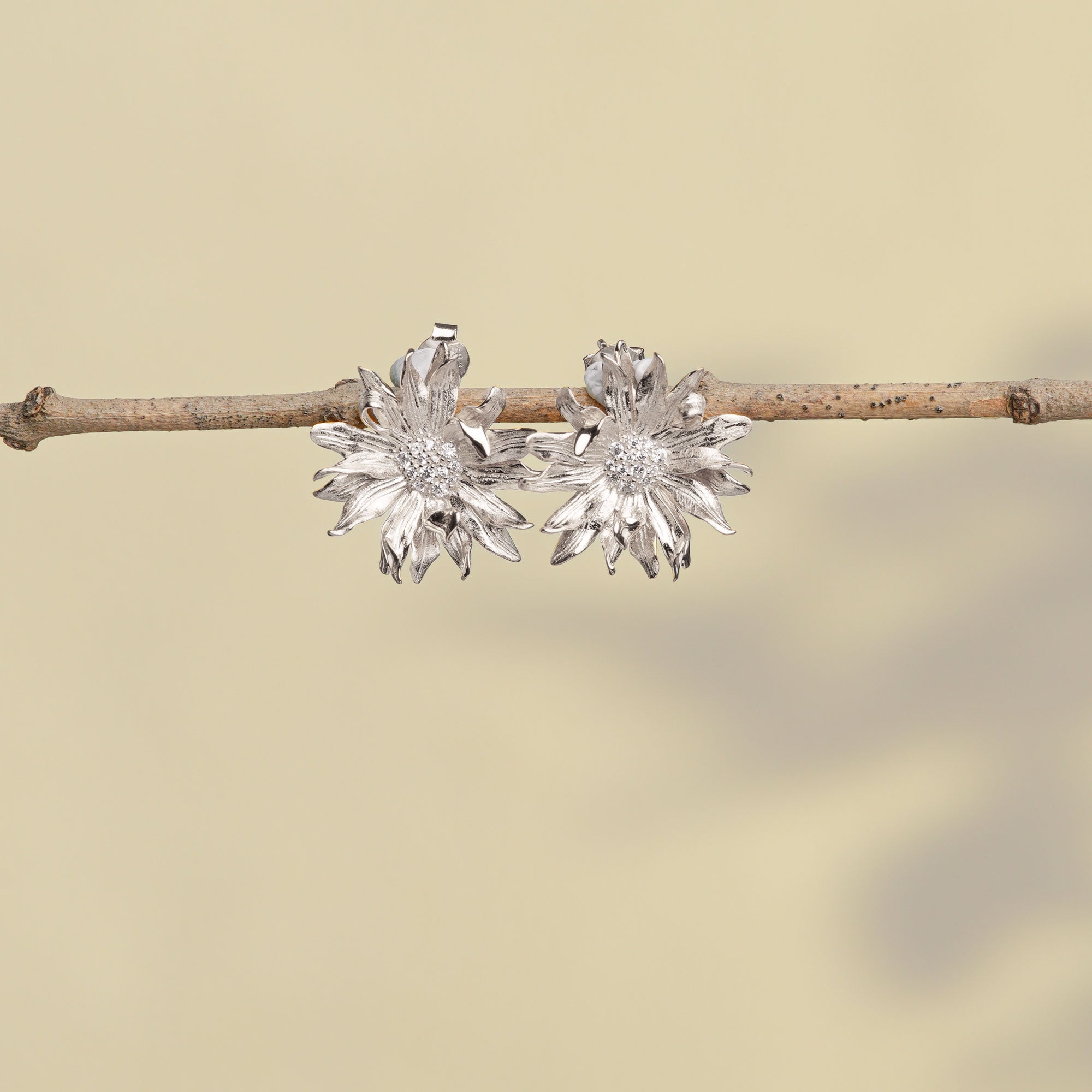 Silver gerbera daisy earrings close-up