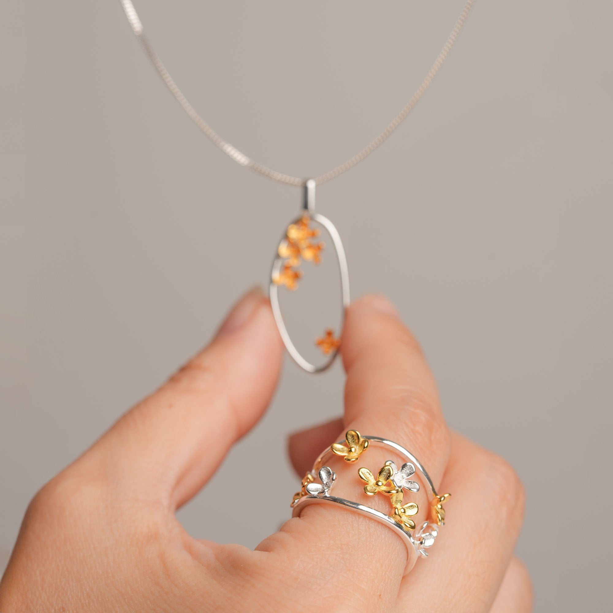 Silver osmanthus flower ring close-up