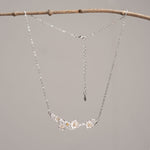 Silver plum blossom necklace close-up