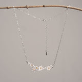 Silver plum blossom necklace close-up