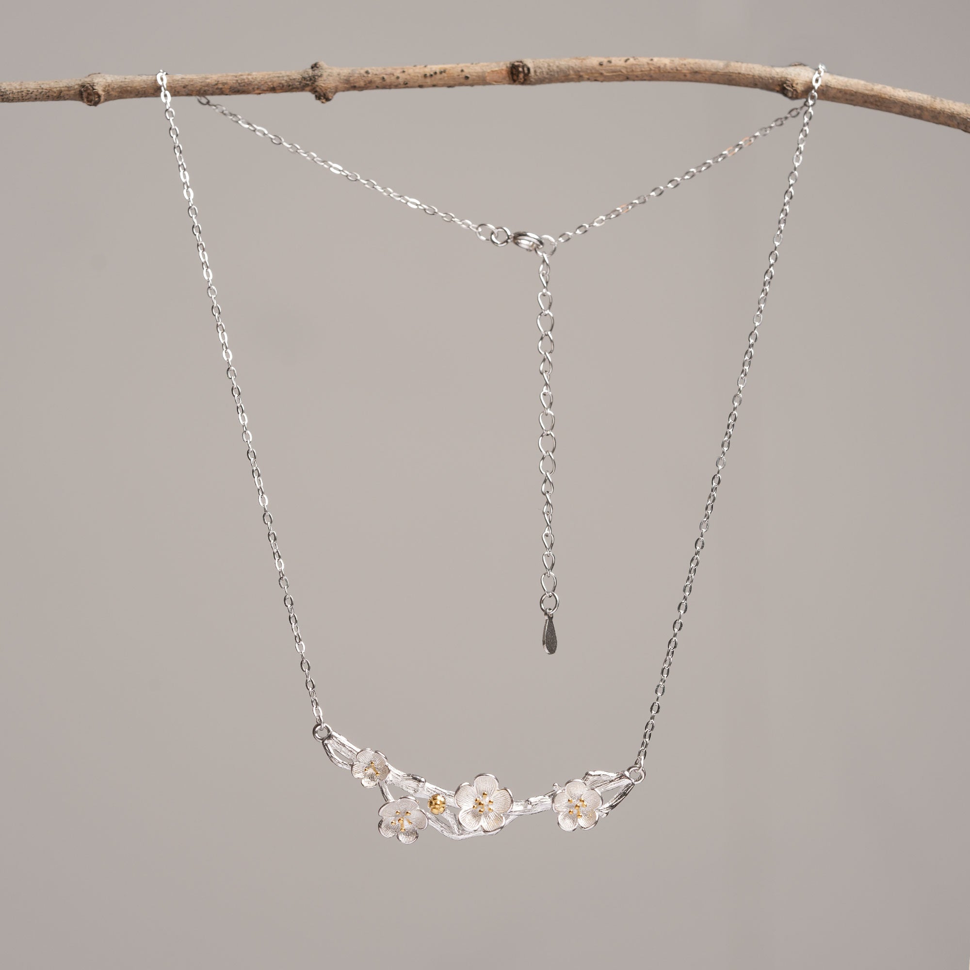 Silver plum blossom necklace close-up