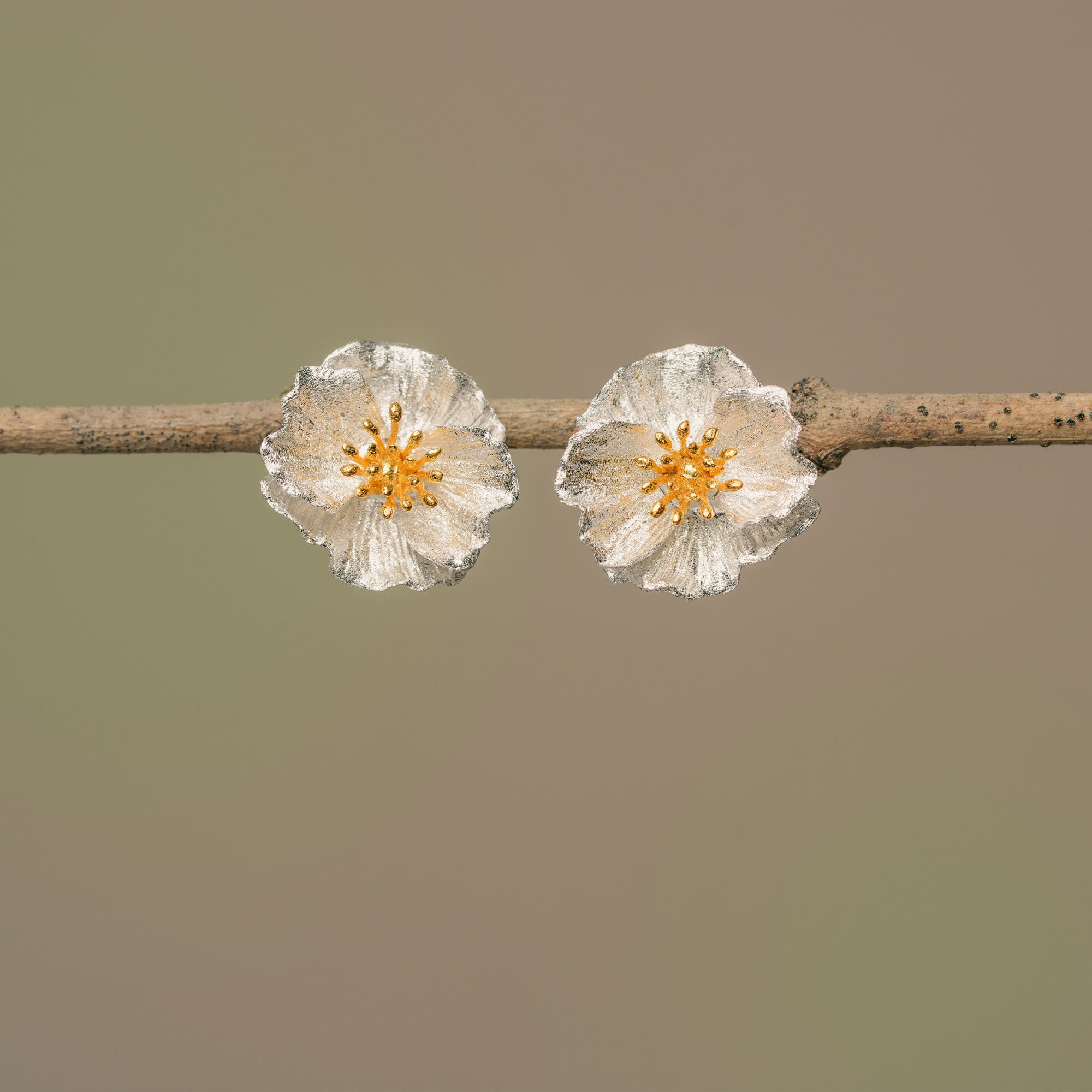 Silver poppy flower earrings product view
