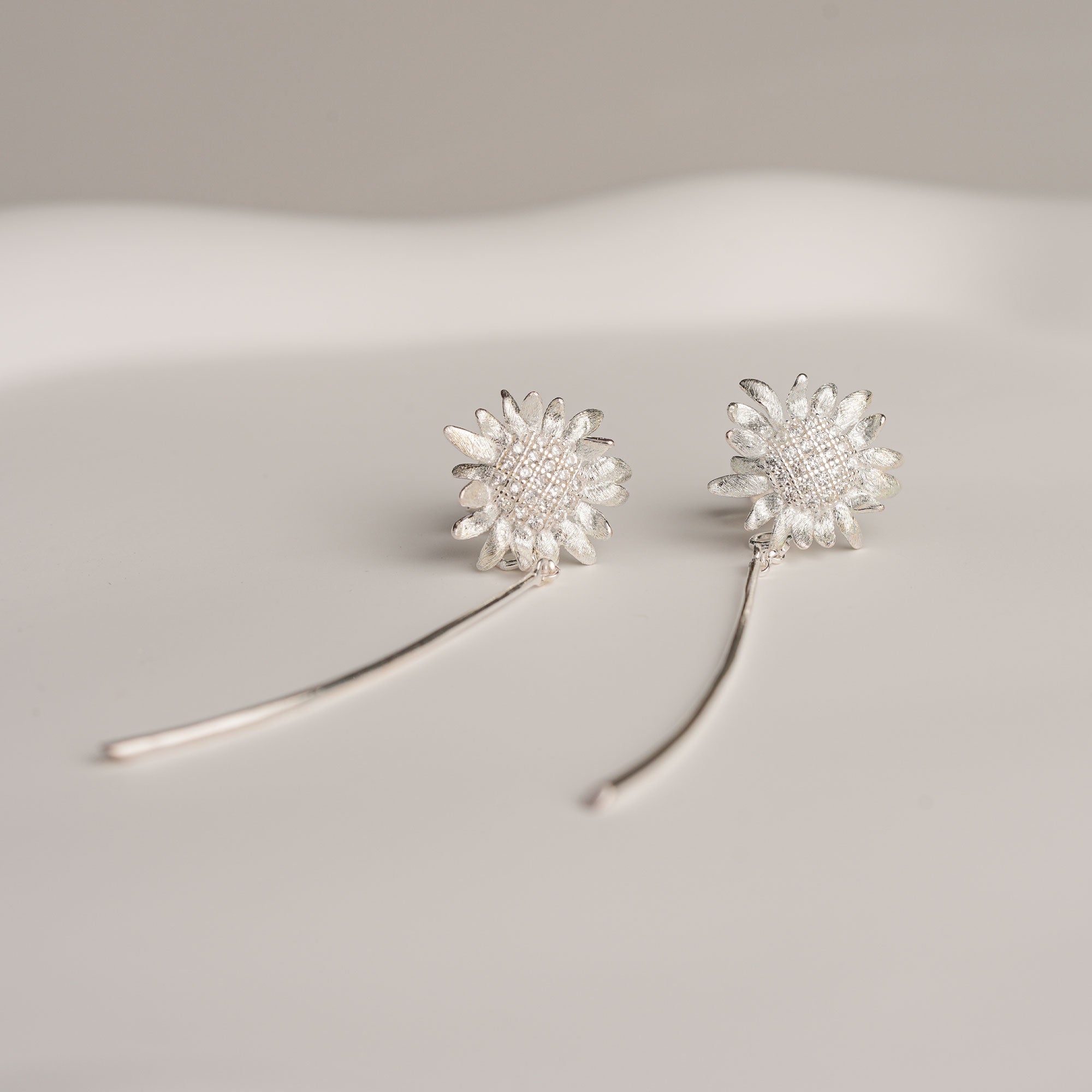 Silver sunflower earrings product view
