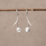 Silver tulip flower huggie earrings