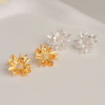 Floral stud earrings with daisy petal details