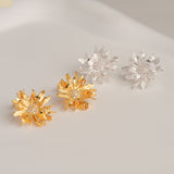 Floral stud earrings with daisy petal details