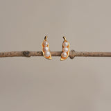 Three peas in a pod pearl earrings showing handmade details