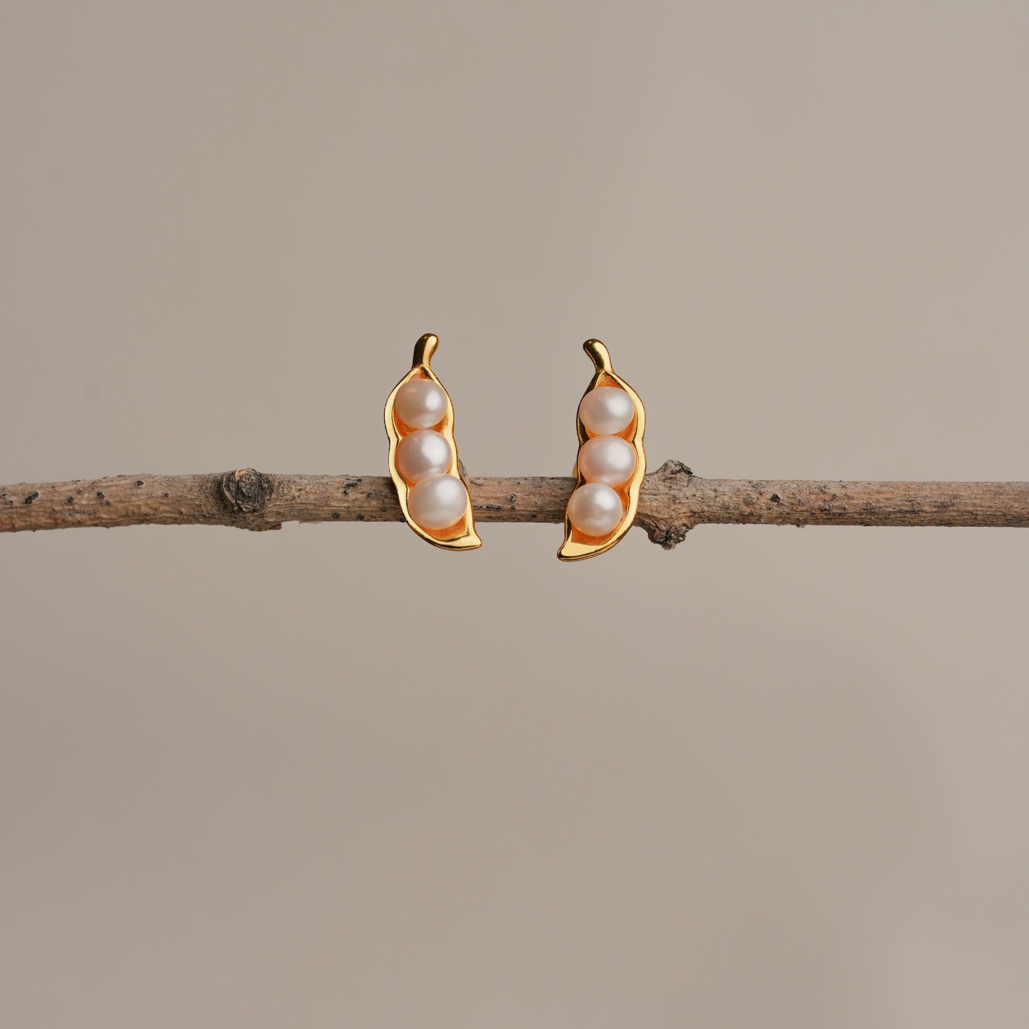 Three peas in a pod pearl earrings showing handmade details