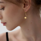 Tulip flower hoop earrings displayed as a pair