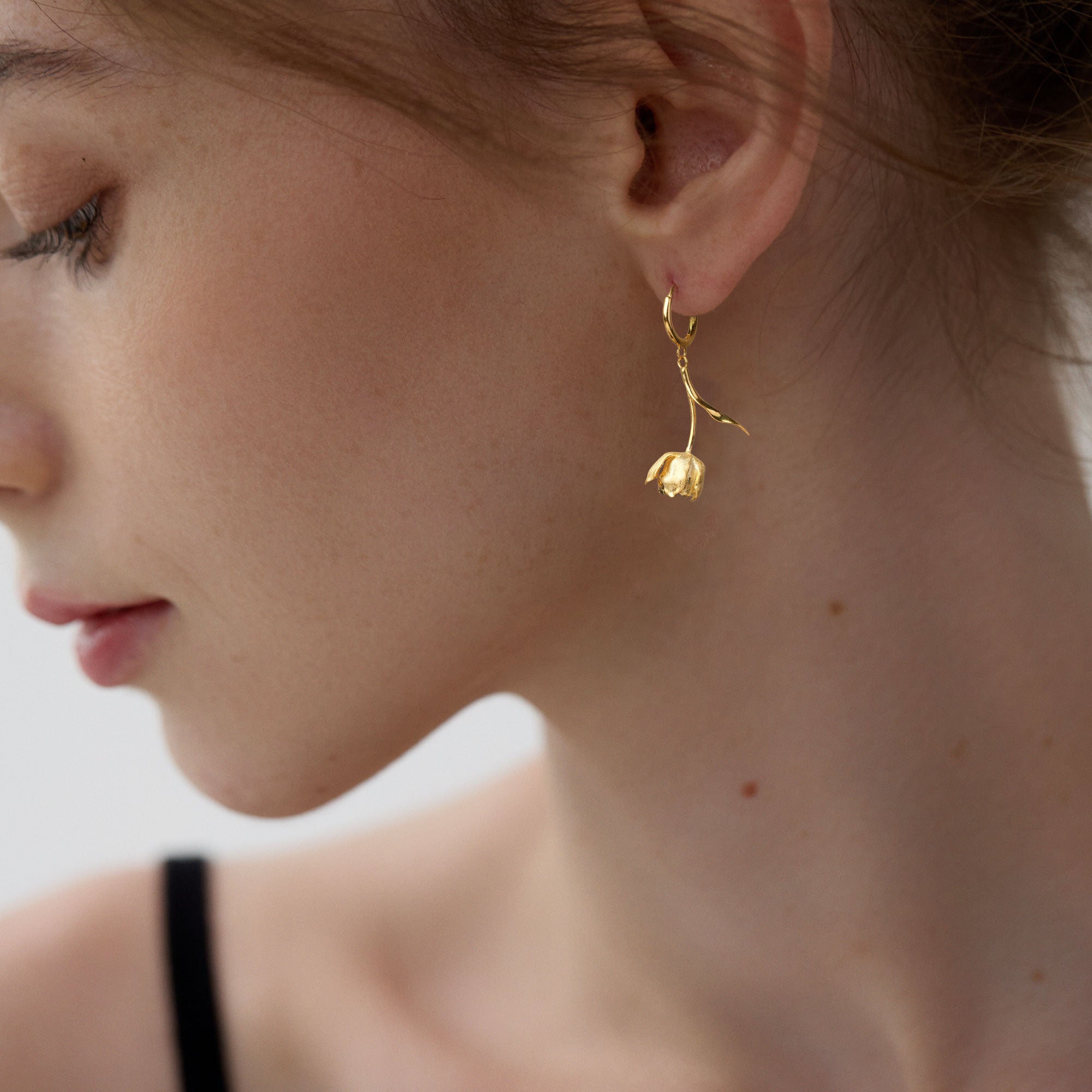 Tulip flower hoop earrings displayed as a pair
