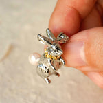Alice rabbit brooch displayed on neutral background
