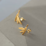 Bamboo earrings on a neutral product background