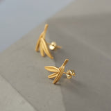 Bamboo earrings on a neutral product background
