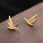 Bamboo leaf earrings showing handmade jewelry details