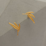 Bamboo leaf earrings displayed as a pair