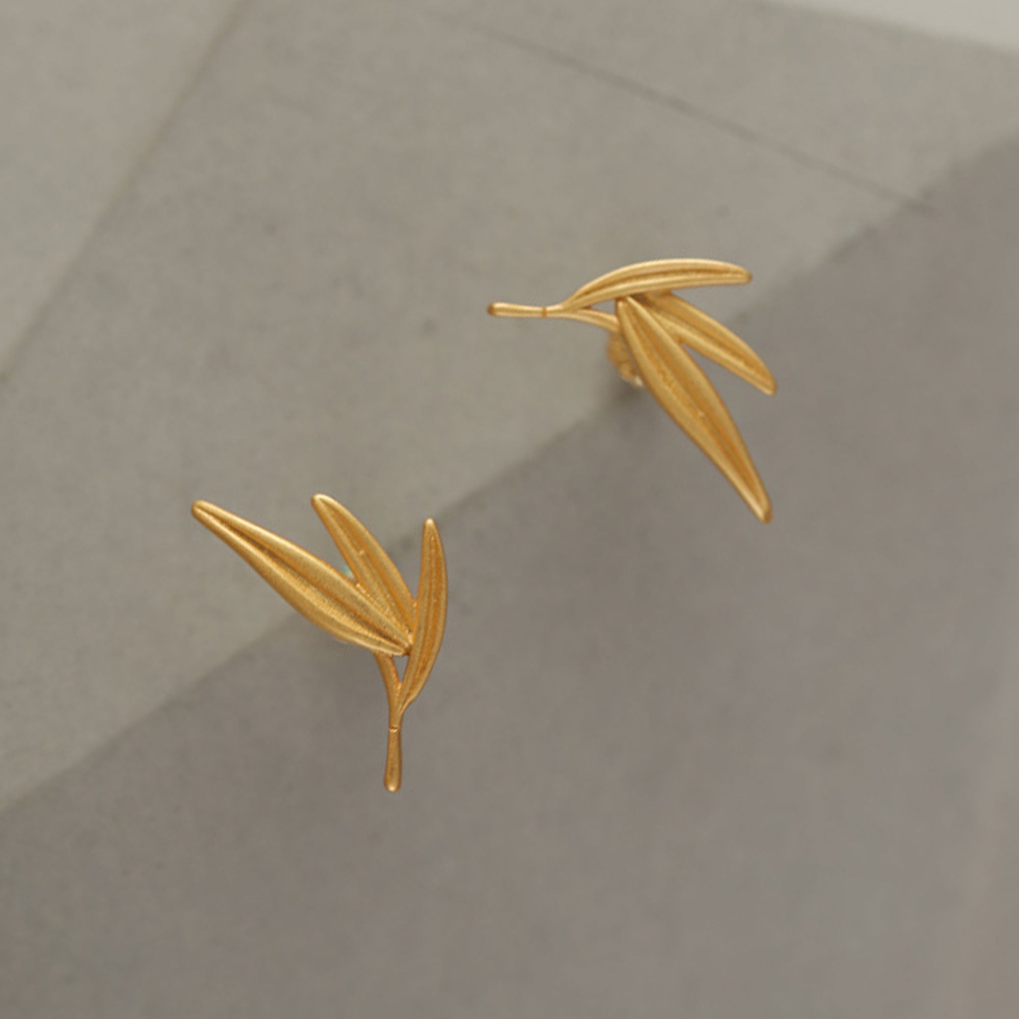 Bamboo leaf earrings displayed as a pair