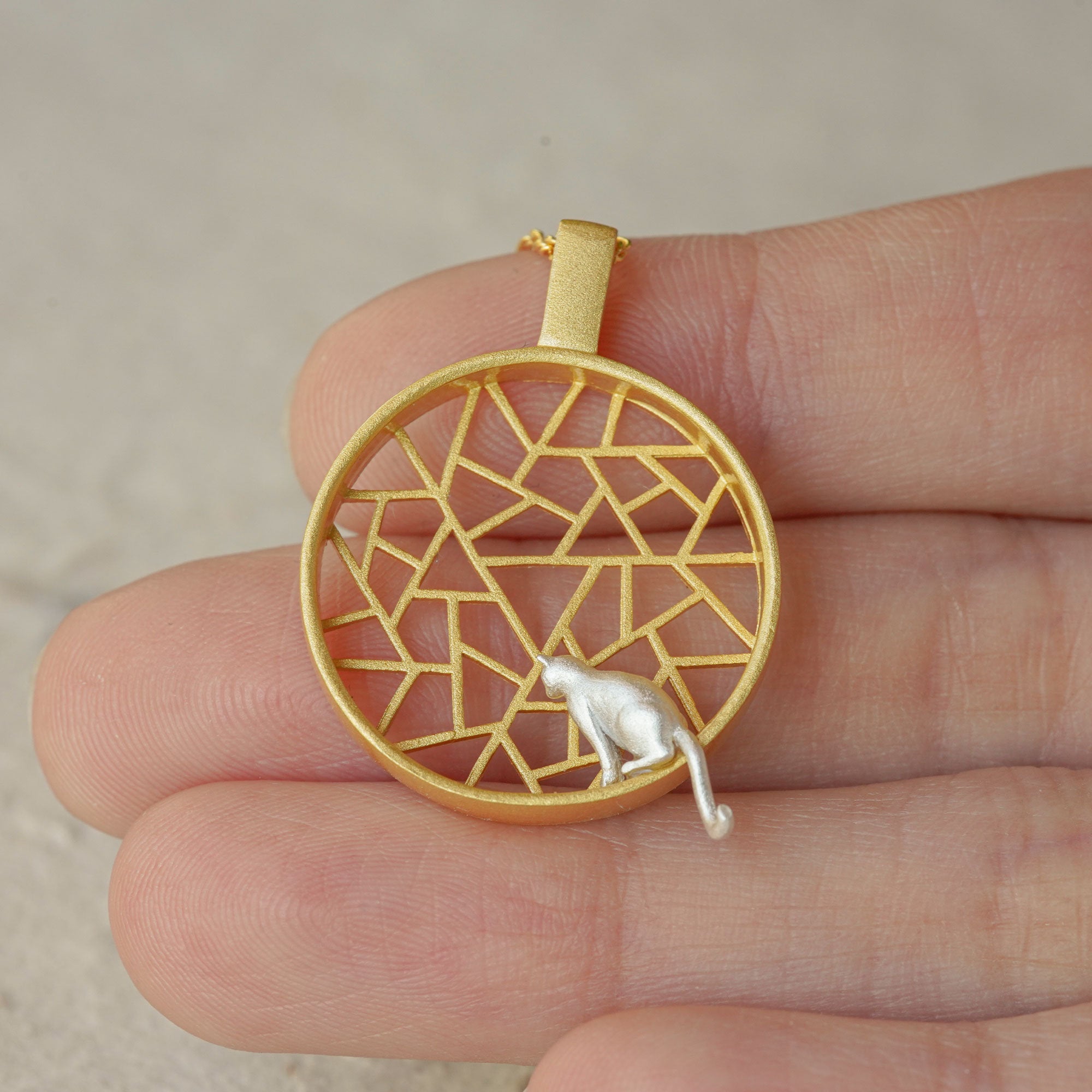 Detailed view of cat necklace