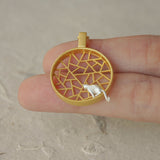 Close-up of cat necklace pendant