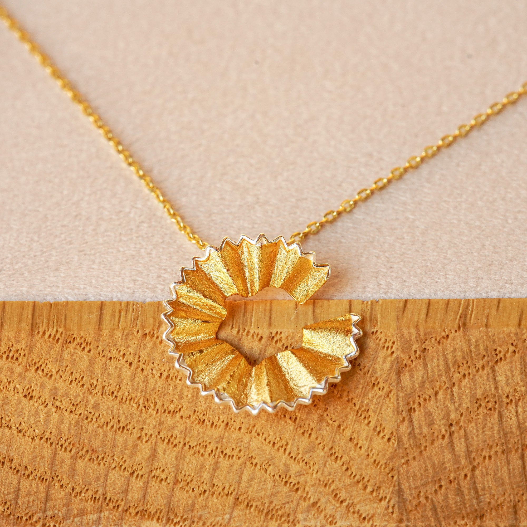 Close-up of art pencil necklace pendant