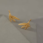 Close-up of bamboo leaf earrings showing leaf details