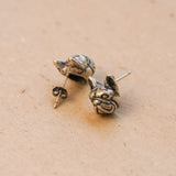 Close-up of French bulldog stud earrings