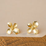 Close-up of gardenia flower earrings showing petal details