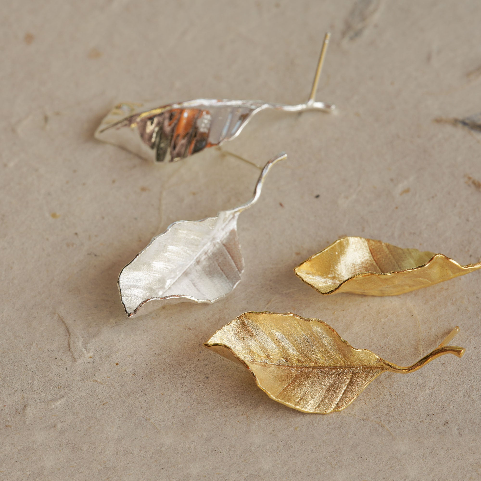 Close-up of leaf drop earrings showing leaf details