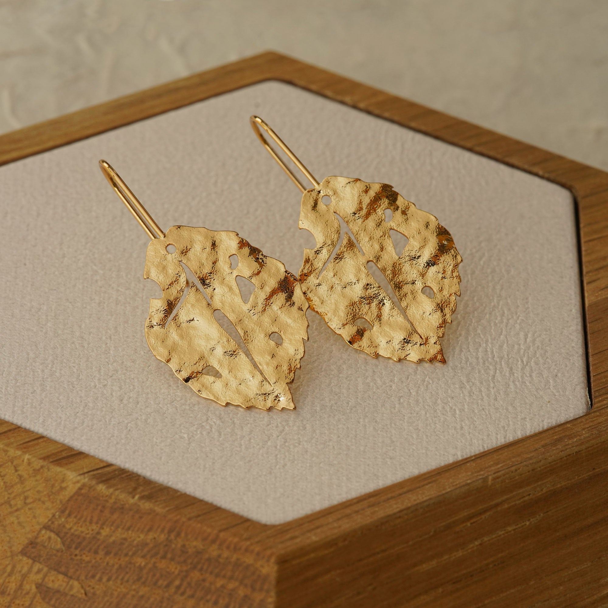 Close-up of leaf earrings showing vein details