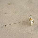Close-up of osmanthus brooch showing blossom details