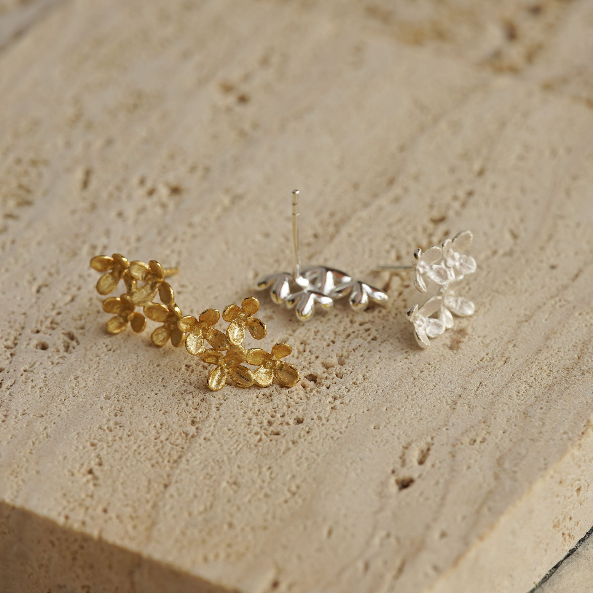Close-up of osmanthus flower earrings showing petal details