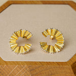 Close-up of pencil earrings showing pencil shape