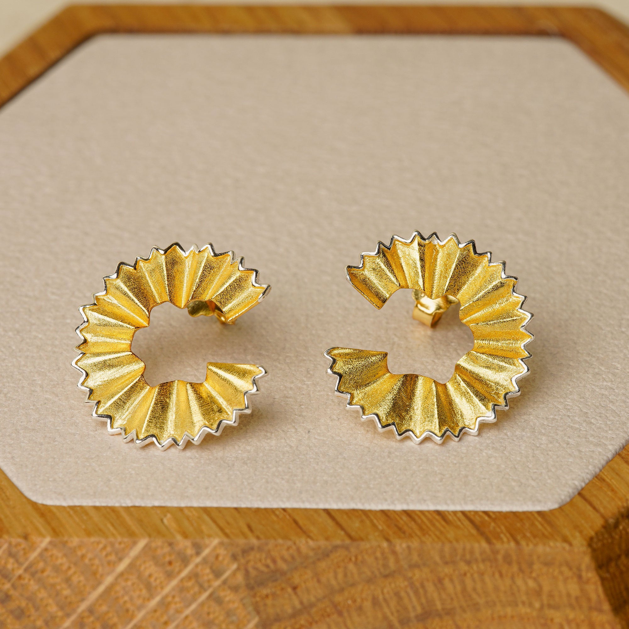 Close-up of pencil earrings showing pencil shape