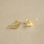 Cloud earrings showing handmade jewelry details