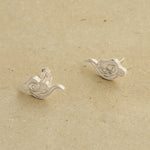 Cloud earrings styled as minimalist jewelry