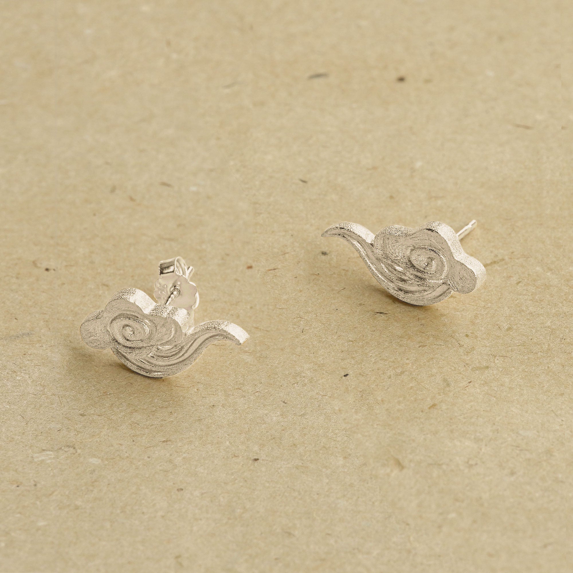 Cloud earrings styled as minimalist jewelry