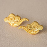 Cloud earrings on a neutral product background